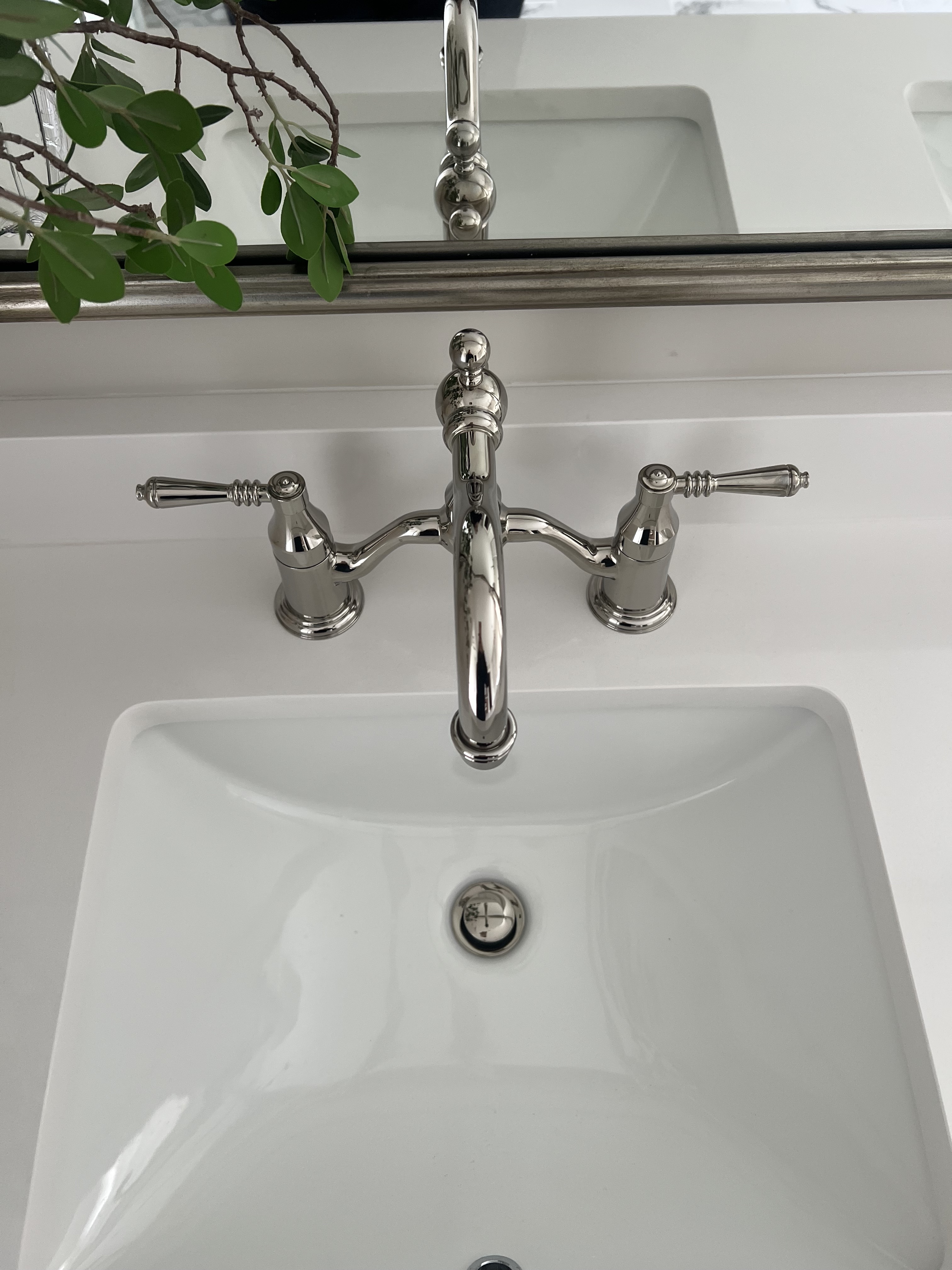 Rolling Hills bathroom — polished nickel bridge faucet detail with undermount sink